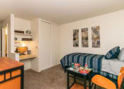 Thumbnail 9 of 31 - Living Room With Kitchen View at Pine View Village Apartments, Flagstaff