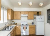 Thumbnail 11 of 36 - Modern Kitchen With Custom Cabinet at University Square Apartments, Arizona, 86001