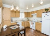 Thumbnail 18 of 36 - Fully Equipped Kitchens And Dining at University Square Apartments, Flagstaff, AZ