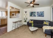 Thumbnail 1 of 36 - Living Room With Kitchen View at University Square Apartments, Flagstaff, Arizona