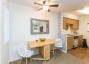 Thumbnail 11 of 56 - Dining Area With Kitchen View at Woodlands Village Apartments, Flagstaff, 86001