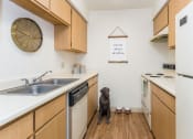 Thumbnail 12 of 56 - Chef-Inspired Kitchens at Woodlands Village Apartments, Flagstaff, Arizona