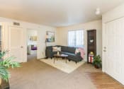 Thumbnail 26 of 56 - Living Room With Expansive Window at Woodlands Village Apartments, Flagstaff, Arizona