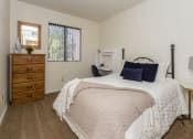 Thumbnail 30 of 56 - Comfortable Bedroom With Large Window at Woodlands Village Apartments, Flagstaff, AZ, 86001