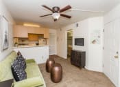 Thumbnail 32 of 56 - Living Room With Kitchen View at Woodlands Village Apartments, Flagstaff, 86001