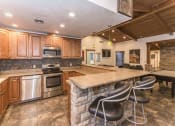 Thumbnail 33 of 56 - Clubhouse Kitchen Area at Woodlands Village Apartments, Flagstaff, Arizona