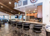 Thumbnail 34 of 56 - Eat-In Table With High Chairs In Clubhouse at Woodlands Village Apartments, Flagstaff
