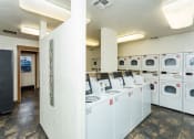 Thumbnail 6 of 56 - Laundry Room at Woodlands Village Apartments, Flagstaff