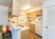Thumbnail 7 of 56 - Fully Equipped Kitchen at Woodlands Village Apartments, Arizona