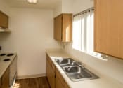 Thumbnail 9 of 56 - Stainless Steel Sink With Faucet In Kitchen at Woodlands Village Apartments, Flagstaff, AZ, 86001