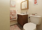 Thumbnail 18 of 22 - a small bathroom with a toilet and a sink