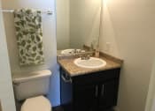 Thumbnail 4 of 38 - a small bathroom with a sink toilet and mirror