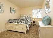 Thumbnail 15 of 22 - a bedroom with a bed and a dresser and a window