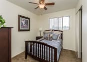 Thumbnail 11 of 38 - Bedroom With Ceiling Fan at Country Club Meadows Apartments, Flagstaff, AZ, 86004