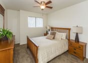 Thumbnail 12 of 38 - Comfortable Bedroom With Large Window at Country Club Meadows Apartments, Flagstaff, AZ