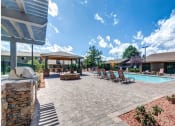 Thumbnail 34 of 38 - Poolside Sundeck And Grilling Area at Country Club Meadows Apartments, Arizona, 86004