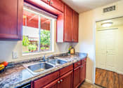 Thumbnail 20 of 22 - a kitchen with a sink and a window