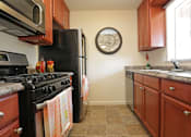 Thumbnail 22 of 22 - kitchen with stainless steel appliances and a window