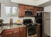 Thumbnail 12 of 29 - Fully Equipped Kitchen at Butterfield Apartments, Flagstaff, AZ, 86004
