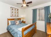 Thumbnail 14 of 29 - Bedroom With Ceiling Fan at Butterfield Apartments, Flagstaff, AZ 86004