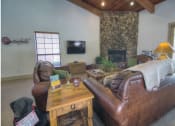 Thumbnail 23 of 29 - Clubroom With TV And Fireplace at Butterfield Apartments, Flagstaff AZ 86004