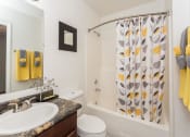 Thumbnail 4 of 29 - Bathroom With Bathtub at Butterfield Apartments, Flagstaff AZ, 86004
