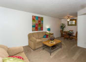 Thumbnail 8 of 29 - Living Room With Kitchen View at Butterfield Apartments, Flagstaff, AZ 86004