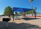 Thumbnail 12 of 22 - a picnic area with picnic tables and bar-b-que grill