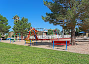 Thumbnail 11 of 22 - a playground with benches and a swing set