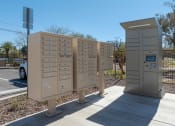 Thumbnail 12 of 32 - a row of mailboxes are lined up next to a sidewalk
