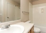 Thumbnail 9 of 9 - a bathroom with a sink and a toilet and a shower