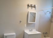 Thumbnail 6 of 9 - a bathroom with a toilet sink and bathtub