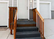 Thumbnail 6 of 48 - A white door with the numbers 648 on it is on the front porch of a house.