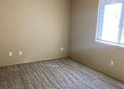 Thumbnail 64 of 82 - A room with a skylight and a carpeted floor.