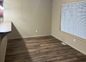Thumbnail 45 of 82 - A room with a wooden wall and a light on the ceiling.
