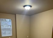 Thumbnail 41 of 82 - A wall with a window and a light on the wall.