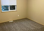 Thumbnail 34 of 82 - A window with blinds in a room with a textured wall.