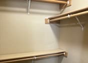 Thumbnail 66 of 82 - A wall with a grey carpet and a white wall.