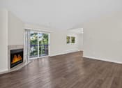 Thumbnail 33 of 42 - A room with a fireplace and sliding glass doors.