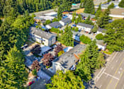 Thumbnail 25 of 42 - A bird's eye view of a residential area with houses and trees.