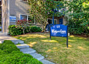 Thumbnail 22 of 42 - A blue sign that says Ridgeline in front of a house.