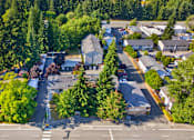 Thumbnail 23 of 42 - A bird's eye view of a residential area with houses and trees.