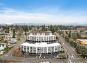 Thumbnail 2 of 36 - an aerial view of a large building in a city
