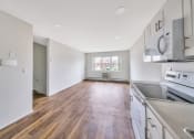 Thumbnail 6 of 27 - Living room view from kitchen at Amity Senior, Amityville, NY 11701