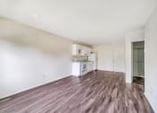Thumbnail 24 of 27 - Living room with kitchen areaat Amity Senior, Amityville, NY 11701