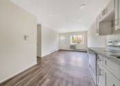 Thumbnail 15 of 27 - Kitchen and living area at Amity Senior, Amityville, NY 11701