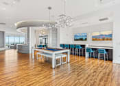 Thumbnail 18 of 26 - A modern dining room with a large table and chairs.