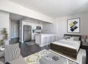 Thumbnail 8 of 20 - a studio apartment with a bed and a kitchen at 34 Berry, Brooklyn, New York