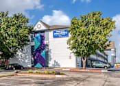 Thumbnail 9 of 22 - an office building with a mural on the side of it