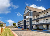 Thumbnail 6 of 22 - the preserve at ballantyne commons apartment building exterior and parking lot